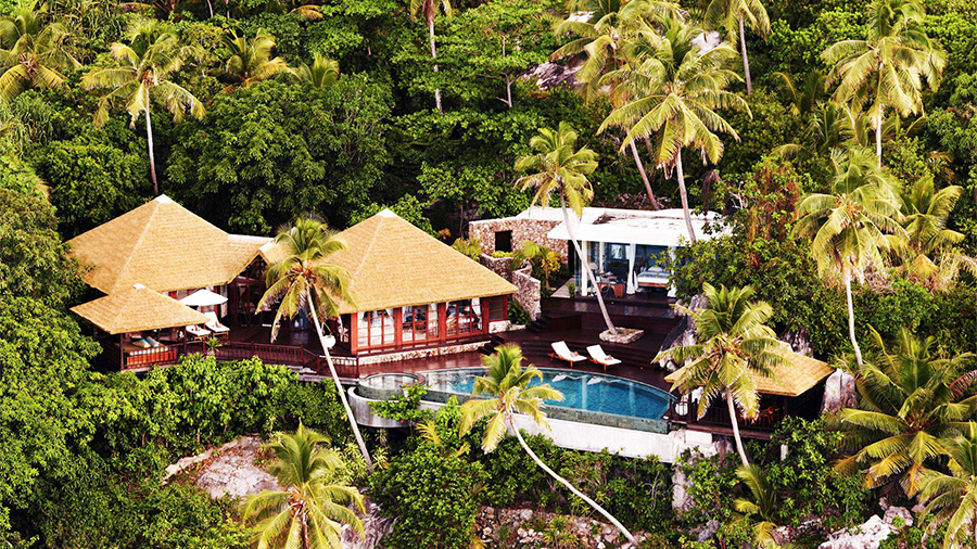 aerial view of buildings with combination thatched roof